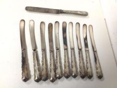 A set of ten Sheffield silver handled butter knives and a 1905 London silver knife with silver