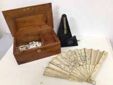 A mixed lot including a late 19thc/early 20thc metronome by Maelzel, an early 20thc lady's fan