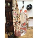 Two traditional Japanese kimonos in silk material with worked floral design (shoulders: 28cm x