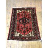 A Tajabad rug, the geometric diamond with stylised floral and geometric designs within multiple