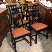 A set of twelve Utility pattern ebonised X splat back dining chairs with slip in seats (sample of