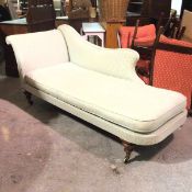 A Victorian mahogany framed chaise longue with upholstered back and scroll arm, in green and gold