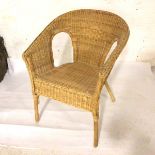 A bamboo and rattan verandah style tub chair (81cm x 26cm x 44cm)