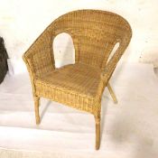 A bamboo and rattan verandah style tub chair (81cm x 26cm x 44cm)