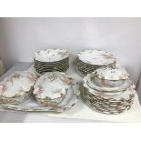 A French part dinner service including fourteen lunch plates (25cm), thirteen soup rims, two