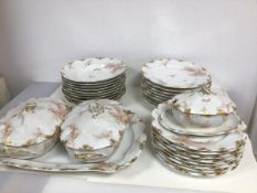 A French part dinner service including fourteen lunch plates (25cm), thirteen soup rims, two