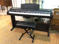 A Roland HP1 Digital piano with stool (81cm x 138cm x 42cm)