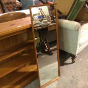 A 1970s teak rectangular framed wall mirror (110cm x 38cm)