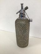A 1930s/40s glass and metal saltzer bottle, top inscribed Sparklets Ltd. (34cm)