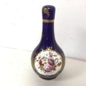 An enamel painted porcelain flask form bottle, probably French, with blue ground and gilt and floral