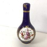 An enamel painted porcelain flask form bottle, probably French, with blue ground and gilt and floral