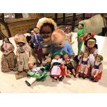 A collection of various costume dolls including Indian dolls, two composition dolls, an Eskimo doll,