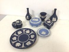 A collection of Wedgwood jasparware including two bud vases (each: 13cm), lidded trinket dishes,