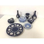 A collection of Wedgwood jasparware including two bud vases (each: 13cm), lidded trinket dishes,