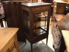 An Edwardian mahogany inlaid dwarf display cabinet, the top with inlaid floral frieze above a glazed