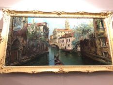Continental School, Gondolas in Venice, oil on canvas, signed bottom left (57cm x 117cm)