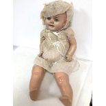 A vintage child's doll stamped A Reliable Doll, made in Canada with squeaker to back, torso and