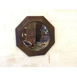 A 1920s leather framed and panelled circular wall mirror (d.43cm)