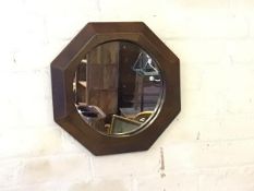 A 1920s leather framed and panelled circular wall mirror (d.43cm)