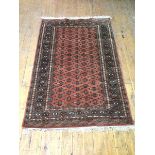 A North West Persian rug, with repeating multiple stylised design within multiple borders,