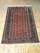 A North West Persian rug, with repeating multiple stylised design within multiple borders,
