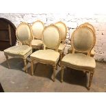 A set of six Louis XVI style side chairs all with distressed upholstered backs and seats, some