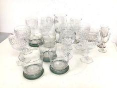 An assortment of drinking glasses including wine glasses, sherry glasses, whisky glasses (tallest: