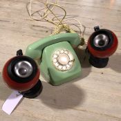 A 1960s green and cream plastic Continental style telephone, a pair of 1970s/80s globe wall