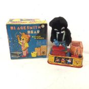 A 1950s Blacksmith Bear battery powered toy, manufactured by A1, complete with original box (box: