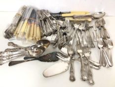 A quantity of Epns flatware including forks, knives, carving sets, table spoons, cake lift, pastry