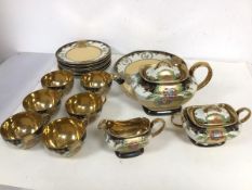 A 1940s/50s Japanese tea service with six teacups, all with gilt interiors, saucers, teapot,