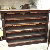 A Victorian mahogany upright open bookcase, the moulded top above four adjustable shelves, raised on