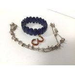 A collection of costume jewellery including a lapis lazuli bracelet (7cm), a pair of earrings with