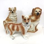 A group of Victorian Staffordshire chimney spaniels, two seated, one standing (some losses to gilt