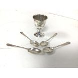 A 1924 Birmingham silver egg cup and four London silver teaspoons (79.89g)