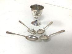A 1924 Birmingham silver egg cup and four London silver teaspoons (79.89g)