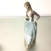 A Spanish Lladro porcelain figure, Girl with Lace Bodice, decorated with polychrome enamels (43cm