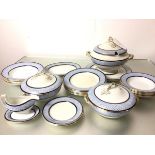 An Edwardian Spode dinner service of twenty seven pieces including soup tureen, cover and flat, a