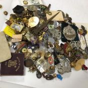A collection of military badges and buttons together with mixed lots of button hole badges etc.,
