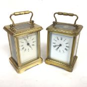A brass London Clock Company four glass carriage clock with enamelled dial and roman numerals (