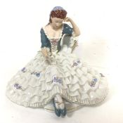 A Royal Dux porcelain figure of a Lady with Crinolene Dress, decorated with polychrome enamels (28cm