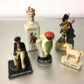 A collection of pub display items including a whisky china musical decanter, a Dewar's whisky