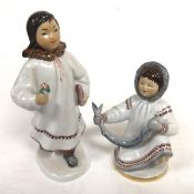 A Russian porcelain Lomonosov figure, Eskimo Girl (21cm) and an Eskimo Girl with Sturgeon, both