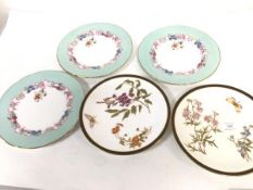 A pair of Royal Worcester Limoges style decorated plates, with butterflies and floral sprays, and