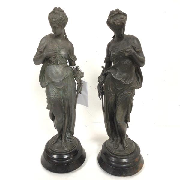 A pair of French style spelter figures, Summer and Spring, raised on circular treen bases (40cm x