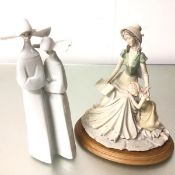 A Spanish Lladro porcelain figure, Two Nuns (35cm) and a composition figure group, Reading Time (