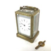 An Edwardian caddy style cased four glass carriage clock with glazed panel sides and top, enamel