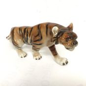 A Royal Dux Austrian china figure of a Tiger (20cm x 41cm) decorated with polychrome enamels