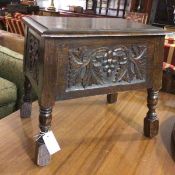 An oak sewing box, the rectangular top with moulded edge with relief carved vine leaf and fruit