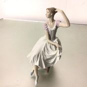 A Spanish Lladro porcelain figure, The Ballerina, decorated with polychrome enamels (32cm x 15cm)